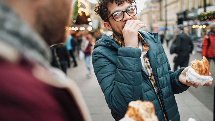 Person is eating and laughing