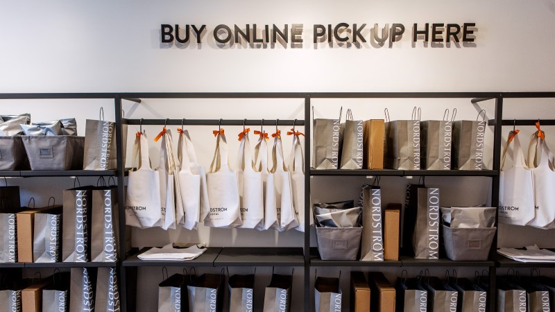 shopping bags hanging in rack for pick up service