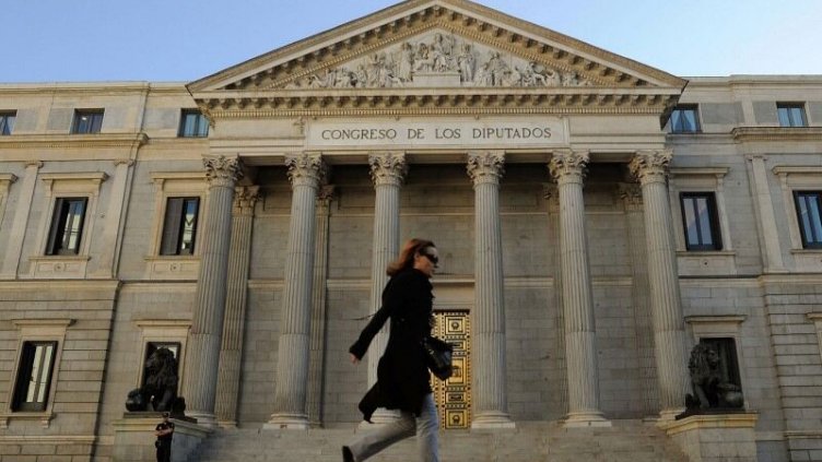 Female walking in the front of Congress of Deputies of Spain