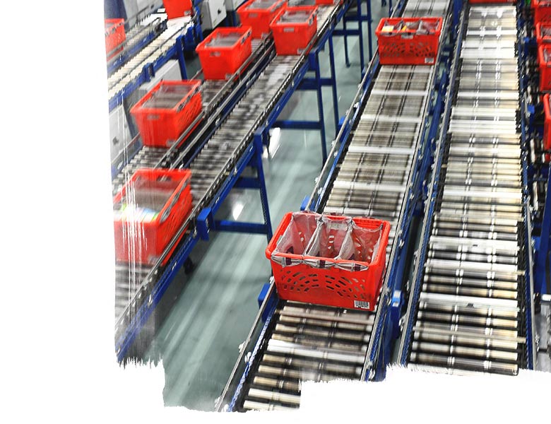 Products being transferred through an automated conveyor system